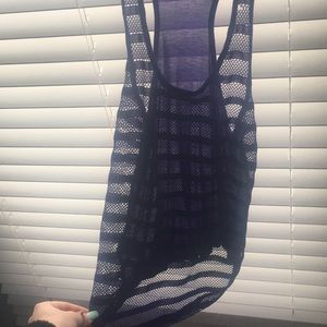 A see through purple tang top